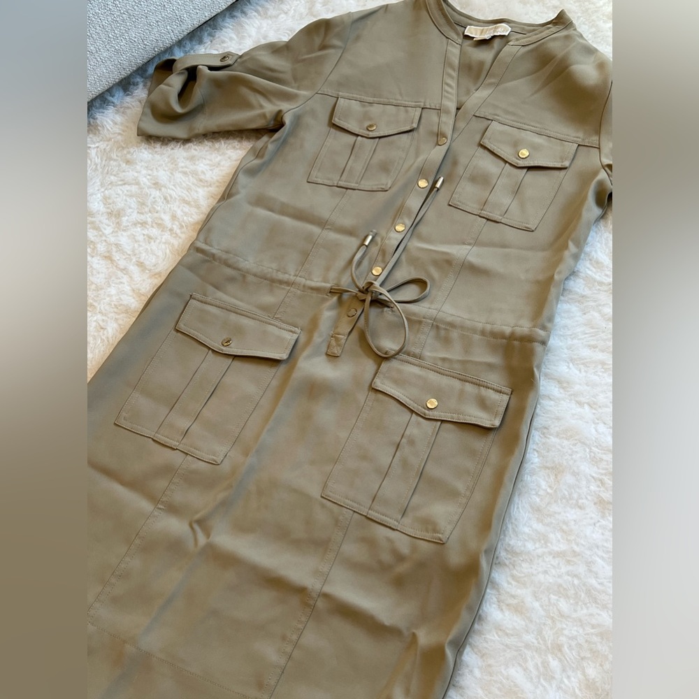 tan-colored safari dress from Michael Kors and is size small.